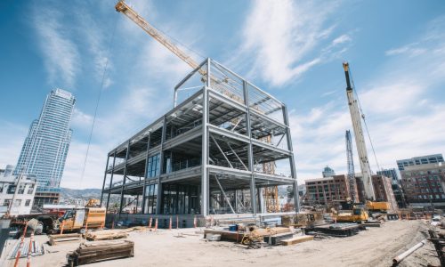 vecteezy_a-construction-site-with-a-crane-and-building-under_68605255